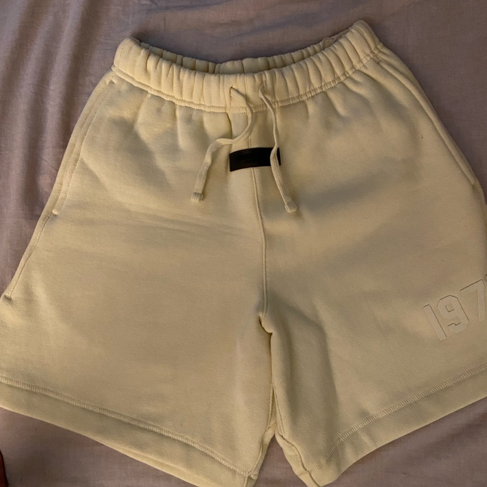 Fear of god essential kid shorts.
